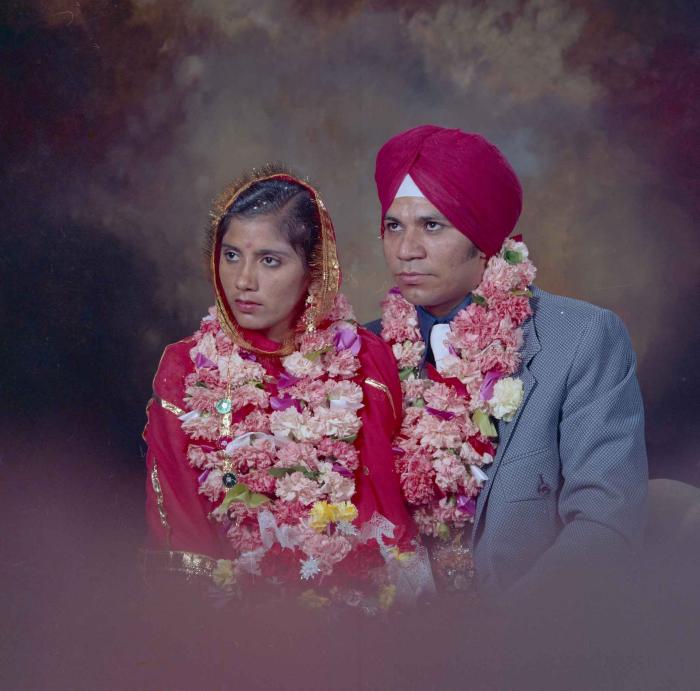 [Group portrait of Daljit Dhaliwal and an unidentified bride]