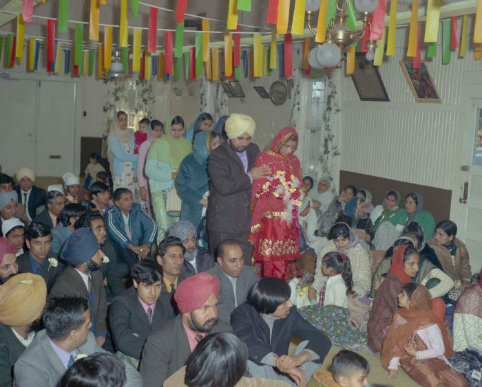 [Photo of an unidentified bride and wedding guests]