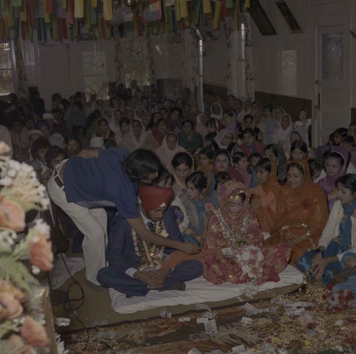 [Photo of Manjit Dhatt, Demindar Gill and wedding guests]