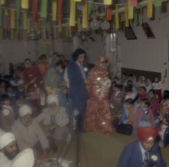 [Photo of Demindar Gill and wedding guests]