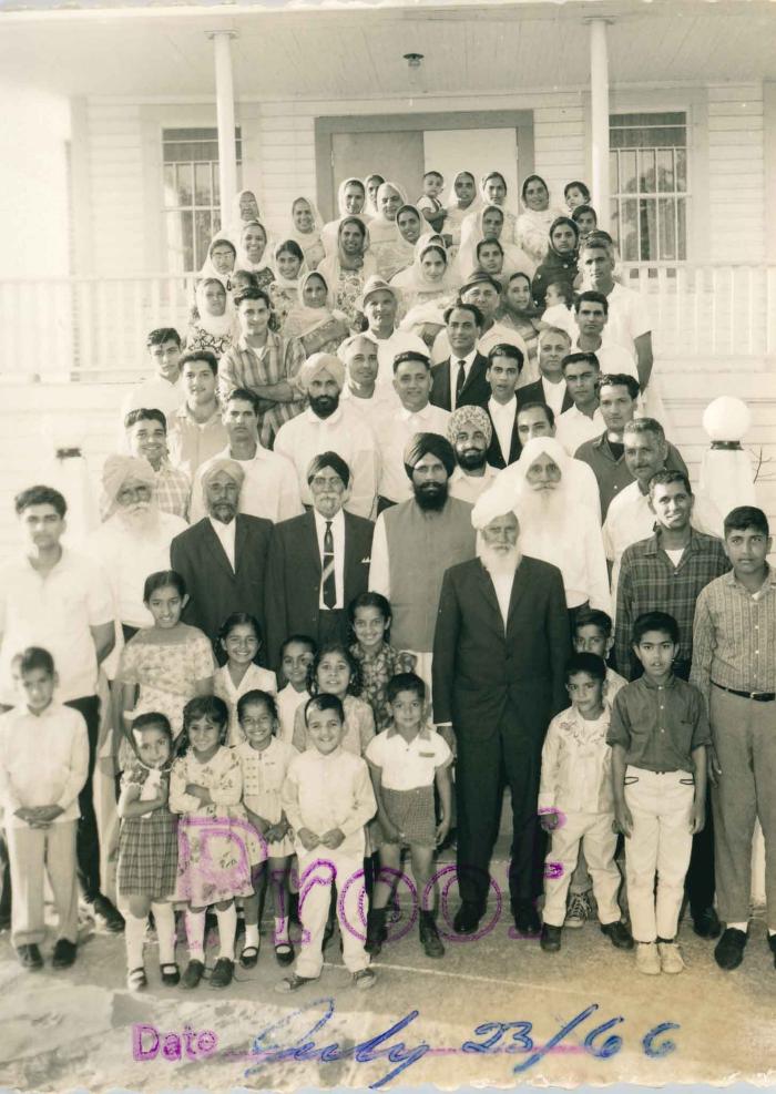 [Photo of unidentified group of people on the Gurdwara steps]