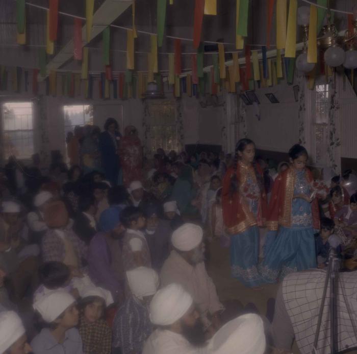 [Photo of Demindar Gill and wedding guests]