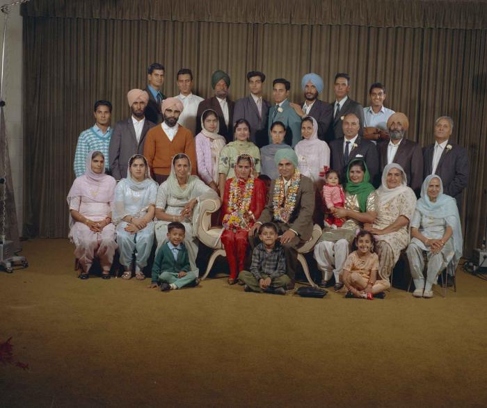 [Group portrait of an unidentified bride, an unidentified groom and wedding guests]