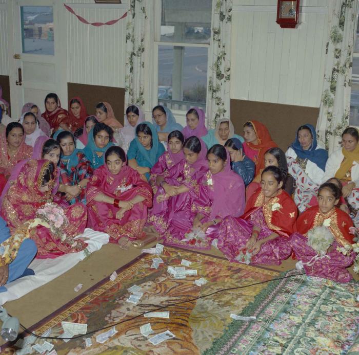 [Photo of Cindy K. Gill and a group of unidentified women]