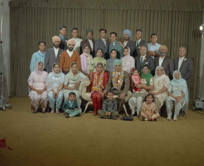 [Group portrait of an unidentified bride, an unidentified groom and wedding guests]