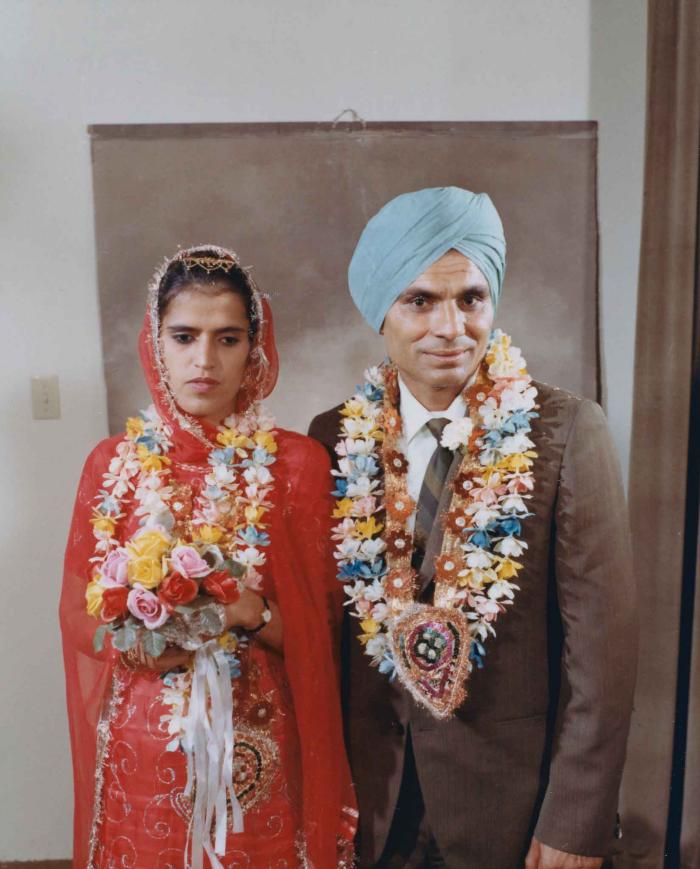 [Group portrait of an unidentified bride and an unidentified groom]