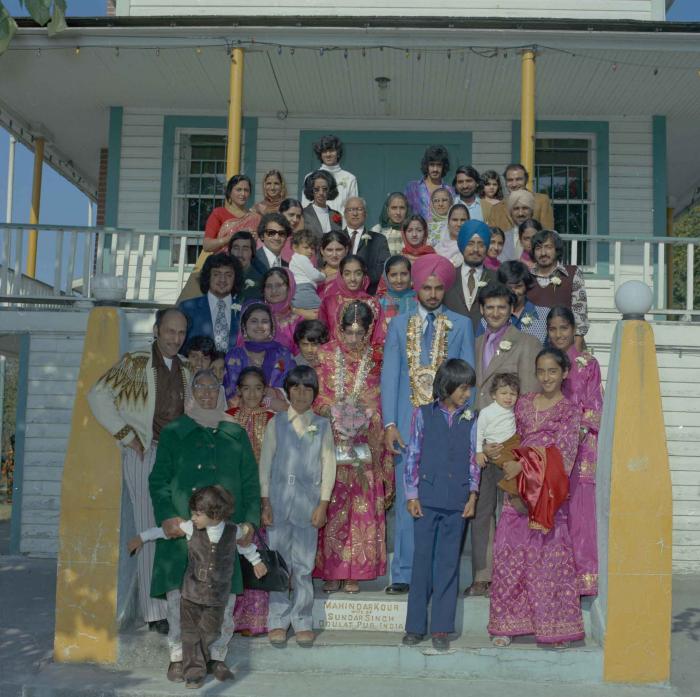 [Photo of Bhagwant S. Grewal, Cindy K. Gill and wedding guests on the steps of the Gurdwara]