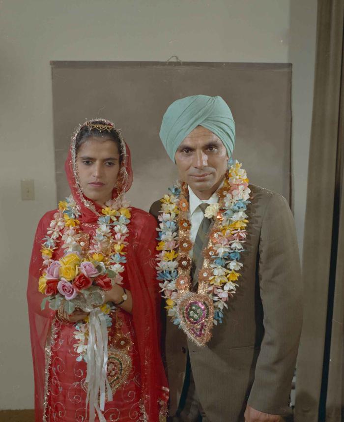 [Group portrait of an unidentified bride and an unidentified groom]