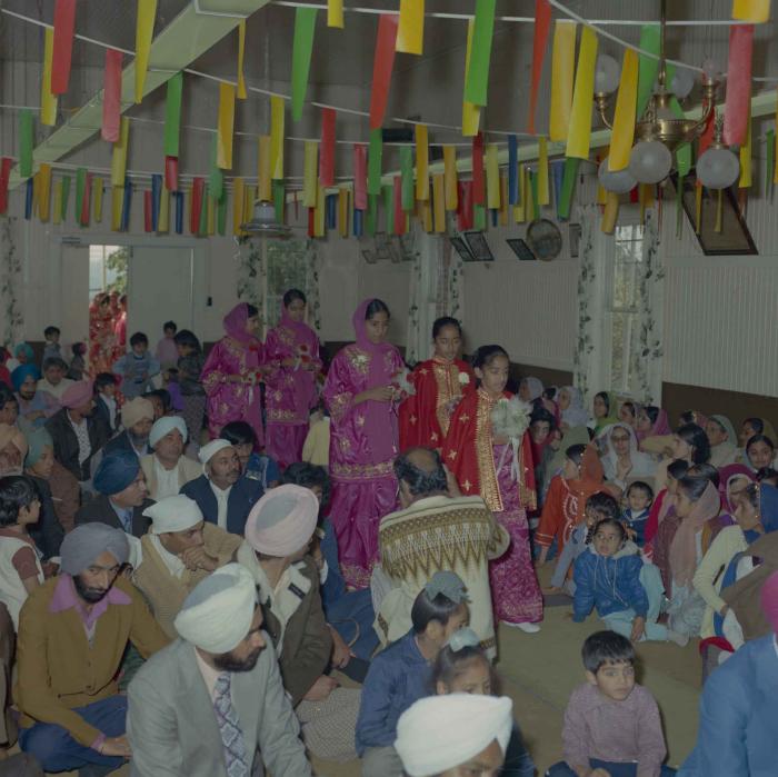 [Photo of unidentified wedding guests in the Gurdwara]