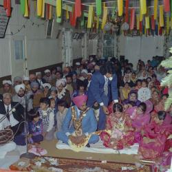 [Portrait of Chindo Sidhu, Iqbal Sandhu and family members at their wedding]
