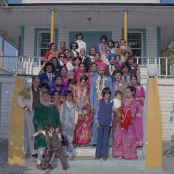 [Photo of Bhagwant S. Grewal, Cindy K. Gill and wedding guests on the steps of the Gurdwara]