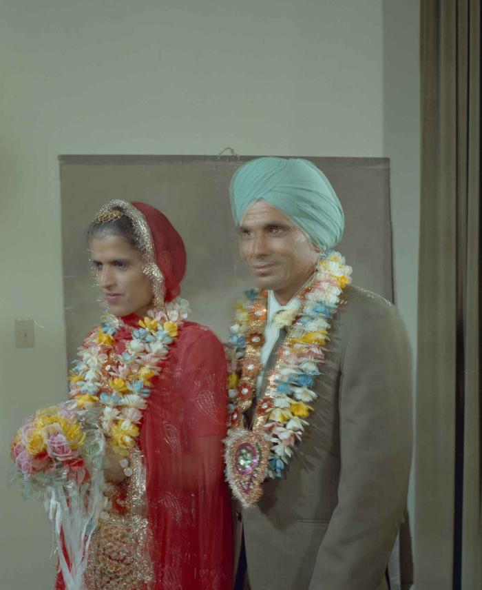 [Group portrait of an unidentified bride and an unidentified groom]
