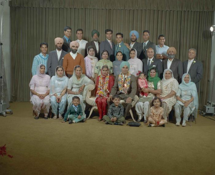 [Group portrait of an unidentified bride, an unidentified groom and wedding guests]
