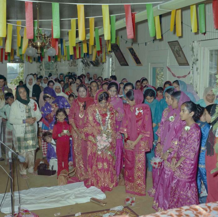 [Photo of Cindy K. Gill and the wedding guests standing in the Gurdwara]