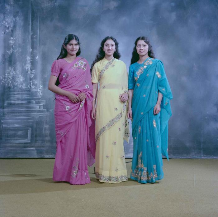 [Group portrait of Mindy Gill and two unidentified women]
