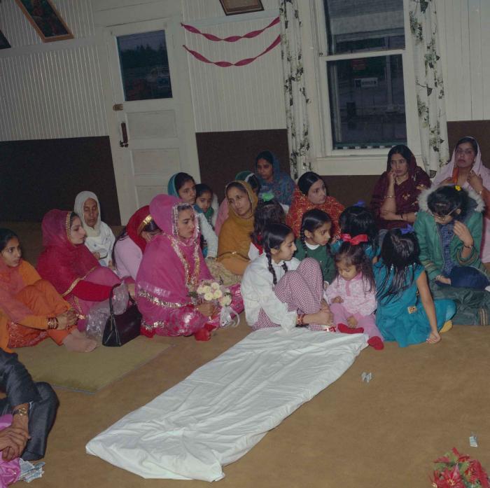 [Photo of Harjinder K. Sidhu and wedding guests]