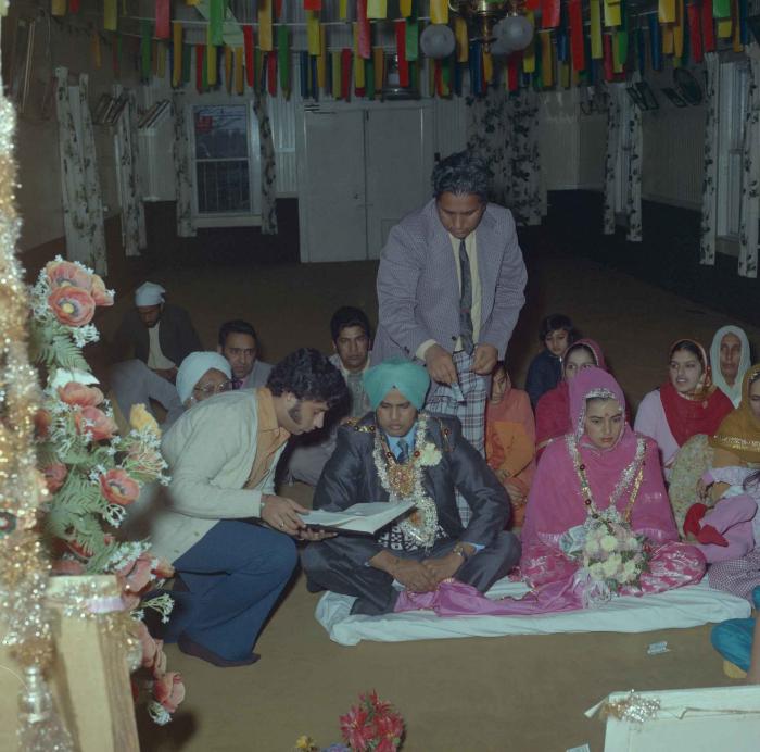 [Photo of Harjinder K. Sidhu, Jagat S. Gill and wedding guests]