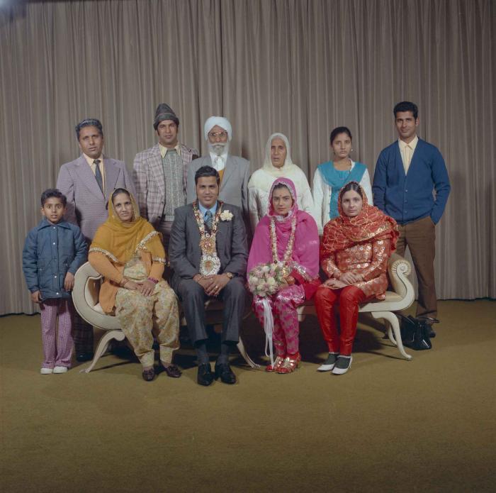 [Group portrait of Harjinder K. Sidhu, Jagat S. Gill and a group of wedding guests]