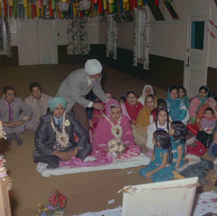 [Photo of Harjinder K. Sidhu, Jagat S. Gill and wedding guests]