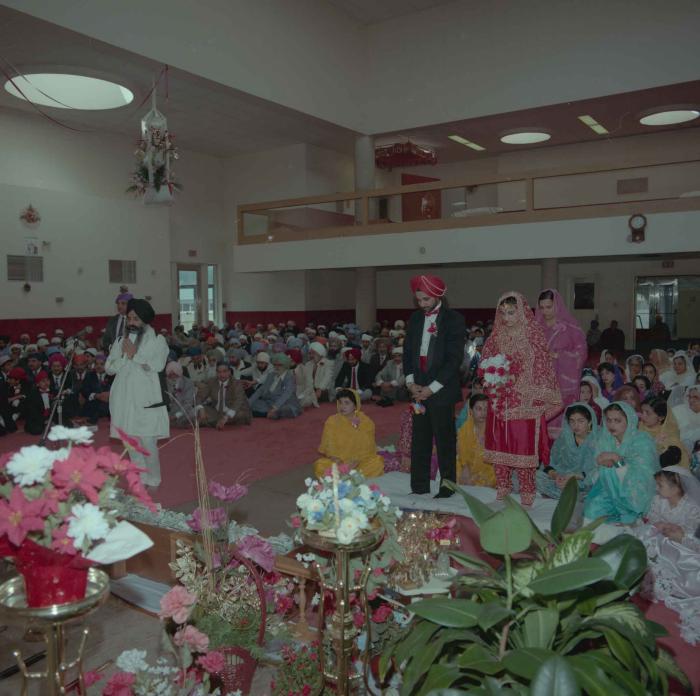 [Photo of Harjinder Gill, Wendy Grewal and the wedding guests]