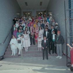 [Photo of Harjinder Gill, Wendy Grewal and the wedding guests posing on the Gurdwara steps]