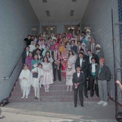 [Photo of Harjinder Gill, Wendy Grewal and the wedding guests posing on the Gurdwara steps]