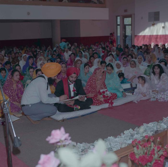 [Photo of Harjinder Gill, Wendy Grewal and the wedding guests]