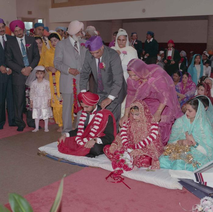 [Photo of Harjinder Gill, Wendy Grewal and the wedding guests]