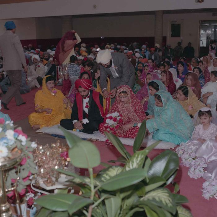 [Photo of Harjinder Gill, Wendy Grewal and the wedding guests]