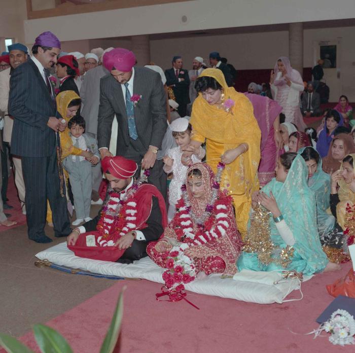 [Photo of Harjinder Gill, Wendy Grewal and the wedding guests]