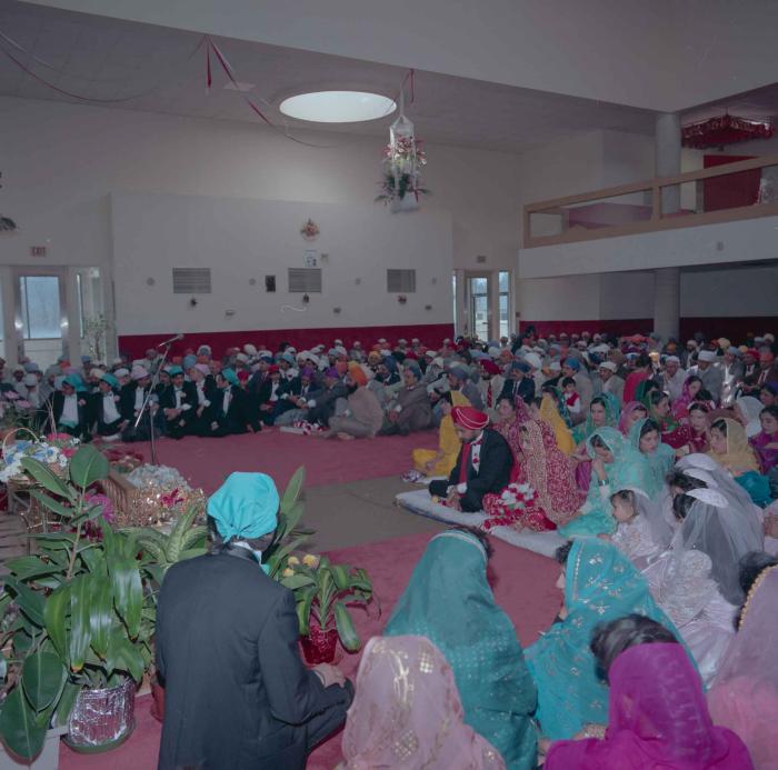 [Photo of Harjinder Gill, Wendy Grewal and the wedding guests]