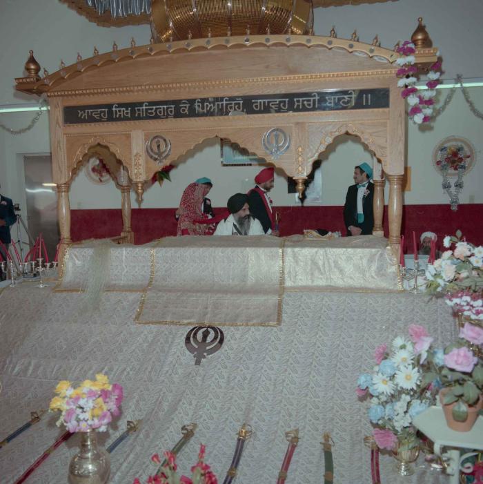 [Photo of Harjinder Gill, Wendy Grewal and the wedding guests]