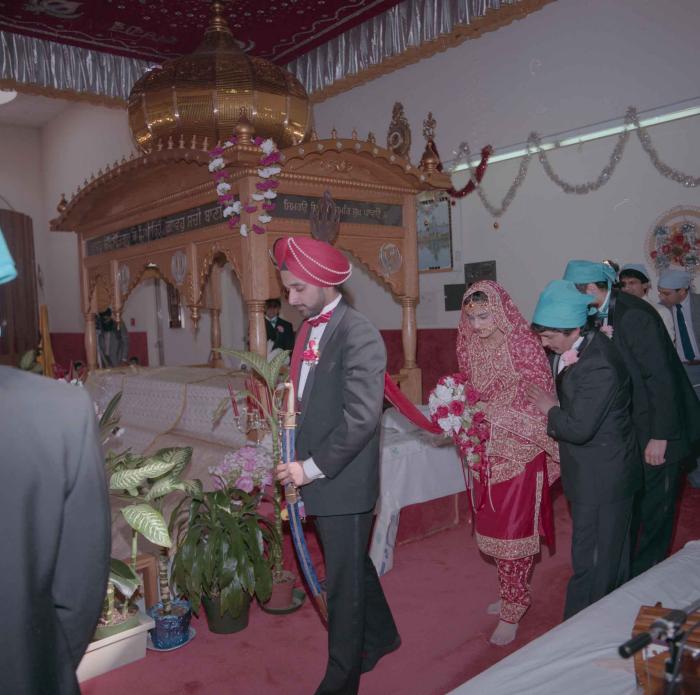 [Photo of Harjinder Gill, Wendy Grewal and the wedding guests]