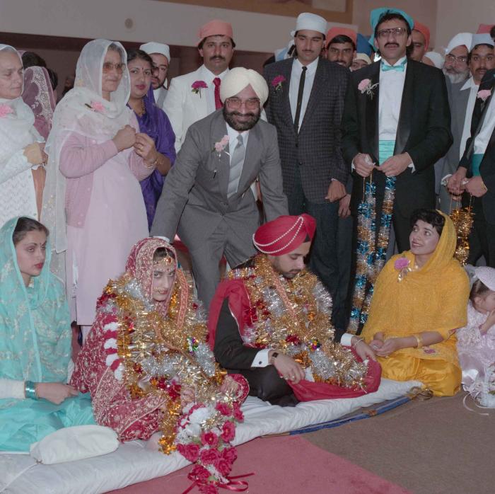 [Photo of Harjinder Gill, Wendy Grewal and the wedding guests]