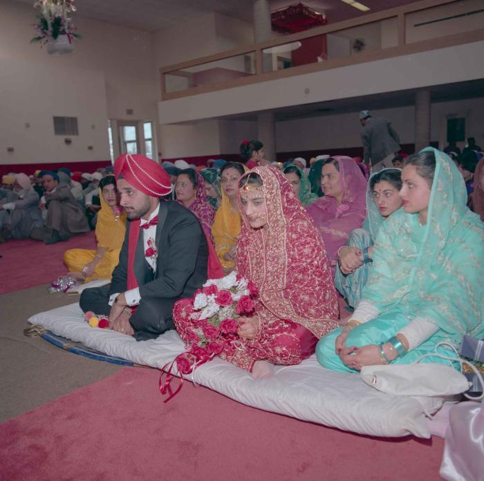 [Photo of Harjinder Gill, Wendy Grewal and the wedding guests]