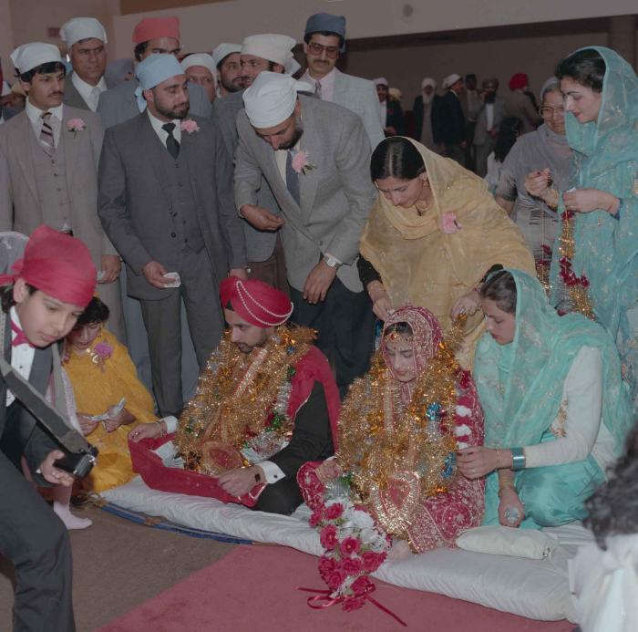 [Photo of Harjinder Gill, Wendy Grewal and the wedding guests]