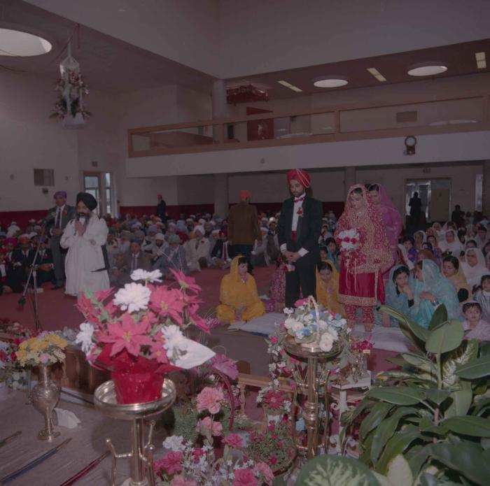 [Photo of Harjinder Gill, Wendy Grewal and the wedding guests]