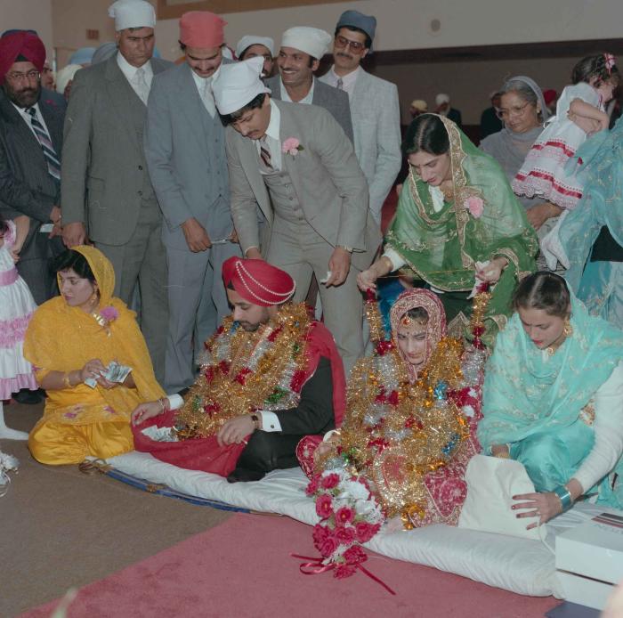 [Photo of Harjinder Gill, Wendy Grewal and the wedding guests]