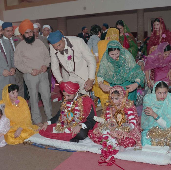 [Photo of Harjinder Gill, Wendy Grewal and the wedding guests]