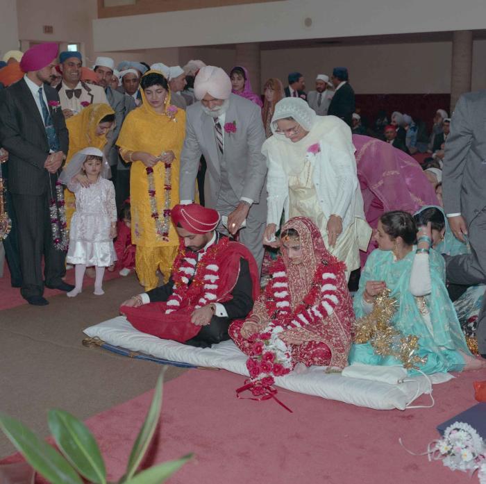 [Photo of Harjinder Gill, Wendy Grewal and the wedding guests]