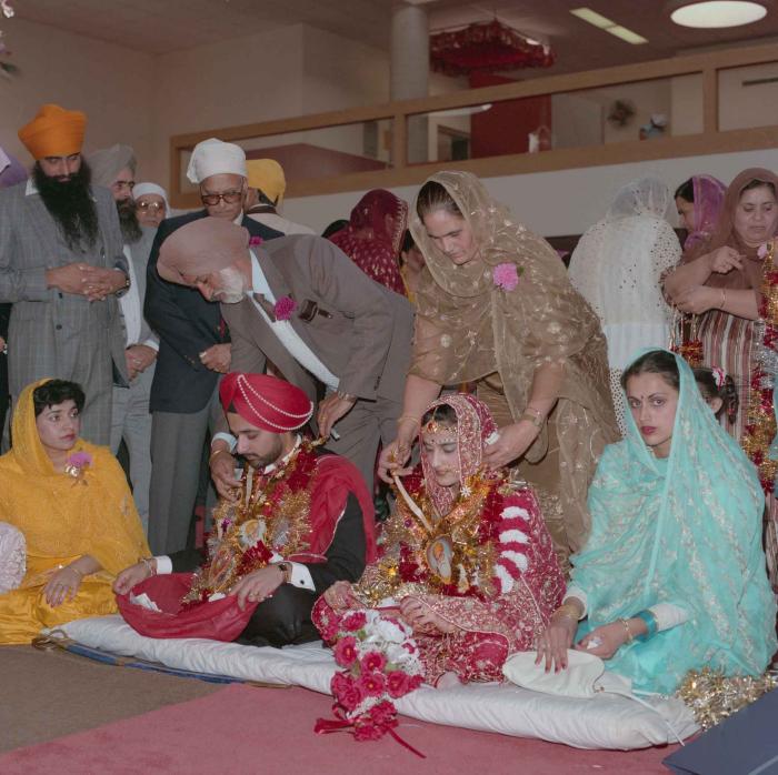 [Photo of Harjinder Gill, Wendy Grewal and the wedding guests]