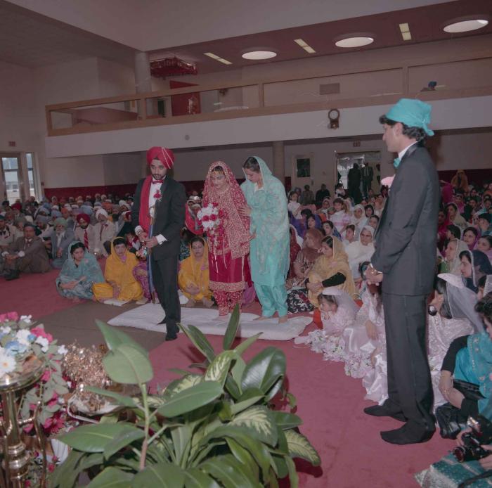 [Photo of Harjinder Gill, Wendy Grewal and the wedding guests]