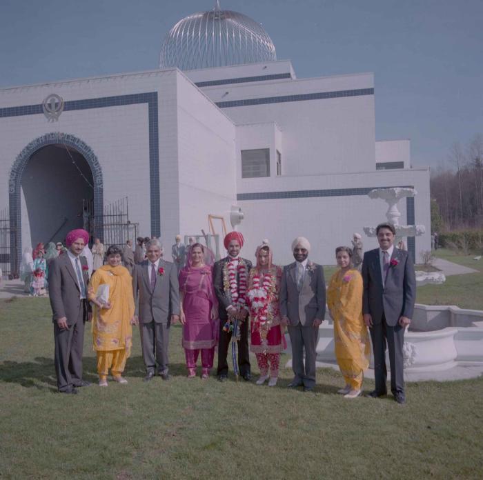 [Photo of Harjinder Gill, Wendy Grewal and wedding guests]