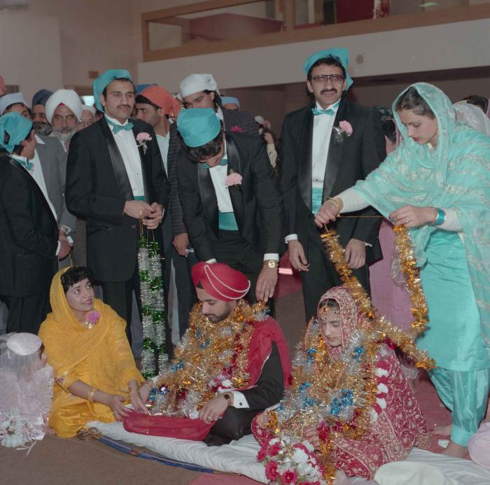 [Photo of Harjinder Gill, Wendy Grewal and the wedding guests]