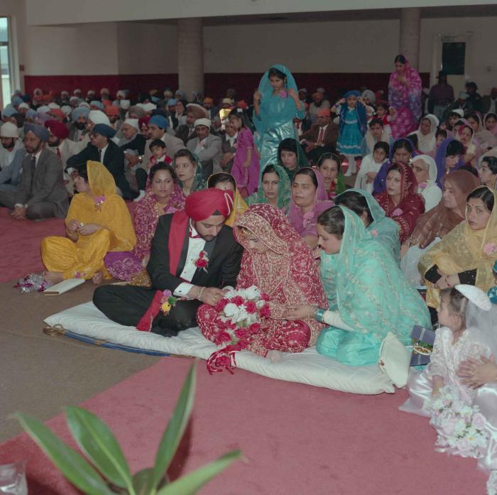 [Photo of Harjinder Gill, Wendy Grewal and the wedding guests]