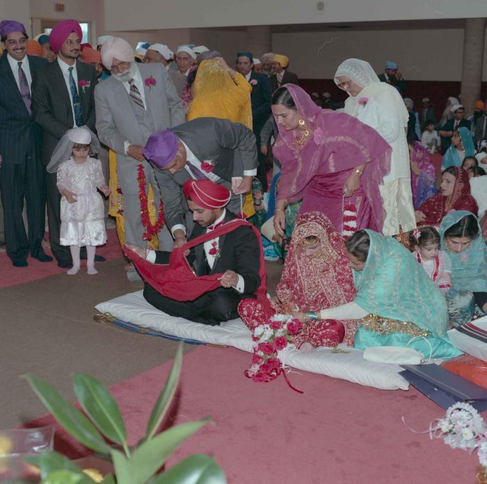 [Photo of Harjinder Gill, Wendy Grewal and the wedding guests]