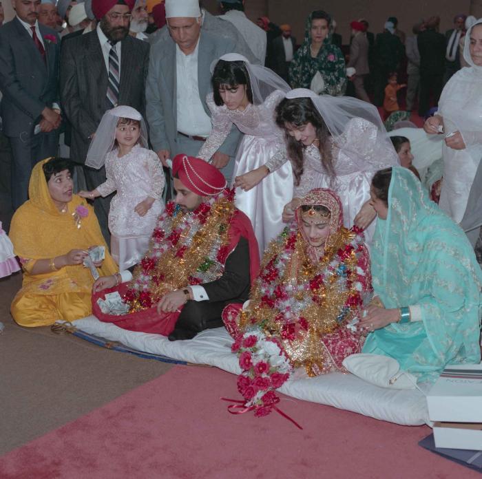 [Photo of Harjinder Gill, Wendy Grewal and the wedding guests]