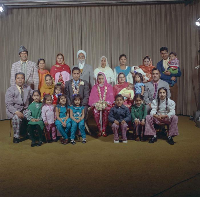 [Group portrait of Harjinder K. Sidhu, Jagat S. Gill and a group of wedding guests]