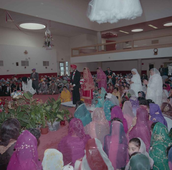 [Photo of Harjinder Gill, Wendy Grewal and the wedding guests]