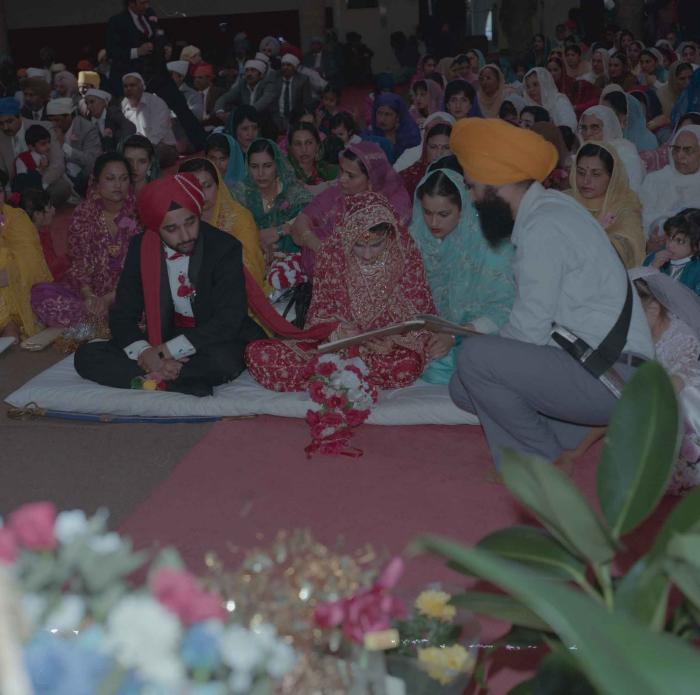 [Photo of Harjinder Gill, Wendy Grewal and the wedding guests]